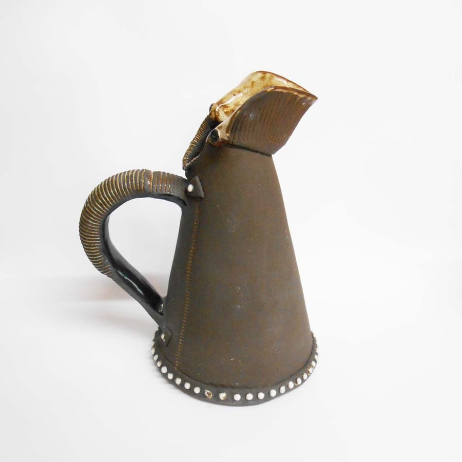 Black Clay Ceramic Jug with Blue, Yellow and red glaze colours.