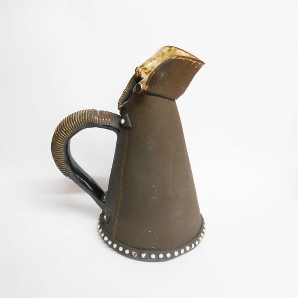 Black Clay Ceramic Jug with Blue, Yellow and red glaze colours.