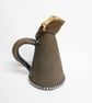 Black Clay Ceramic Jug with Blue, Yellow and red glaze colours.