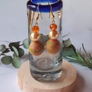 Handmade dangly polymer clay earrings  in tangerine and green