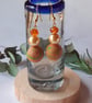 Handmade dangly polymer clay earrings  in tangerine and green