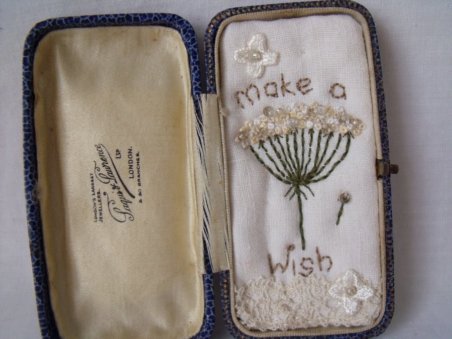small miniature art diorama with a message 'make a wish' in a vintage box