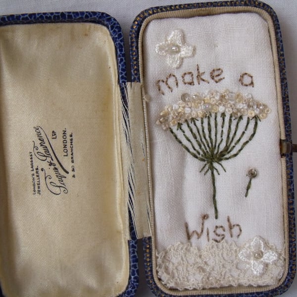 small miniature art diorama with a message 'make a wish' in a vintage box
