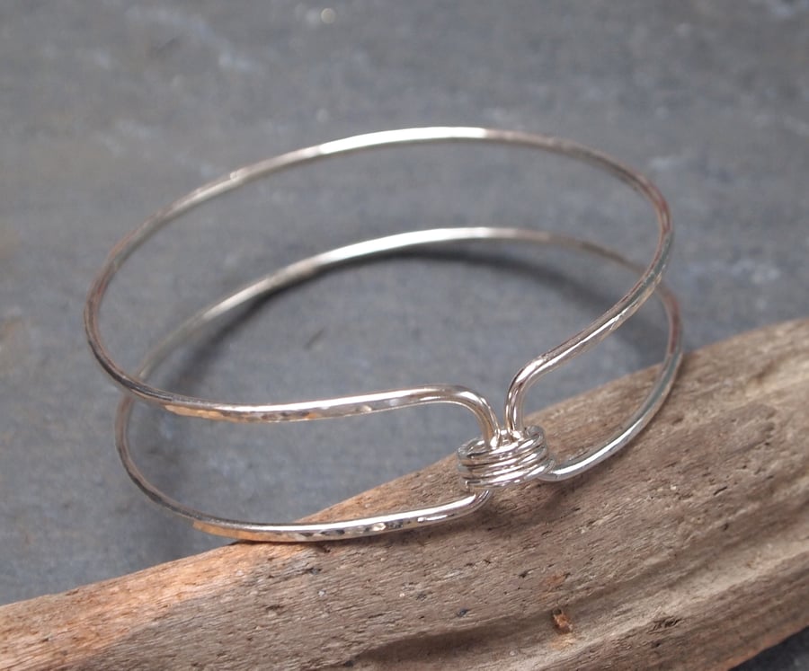 Hallmarked sterling silver bangle with spinner rings