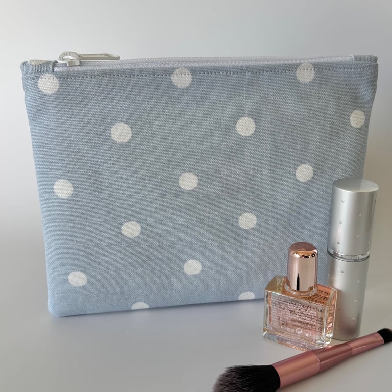 Large flat cotton zipped pouch, purse, make up bag in blue with white polka dots
