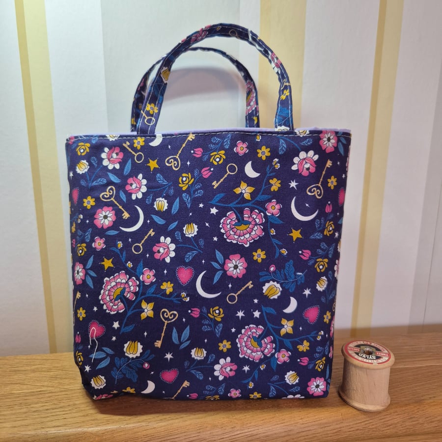 Fabric gift bag: keys and floral on purple 