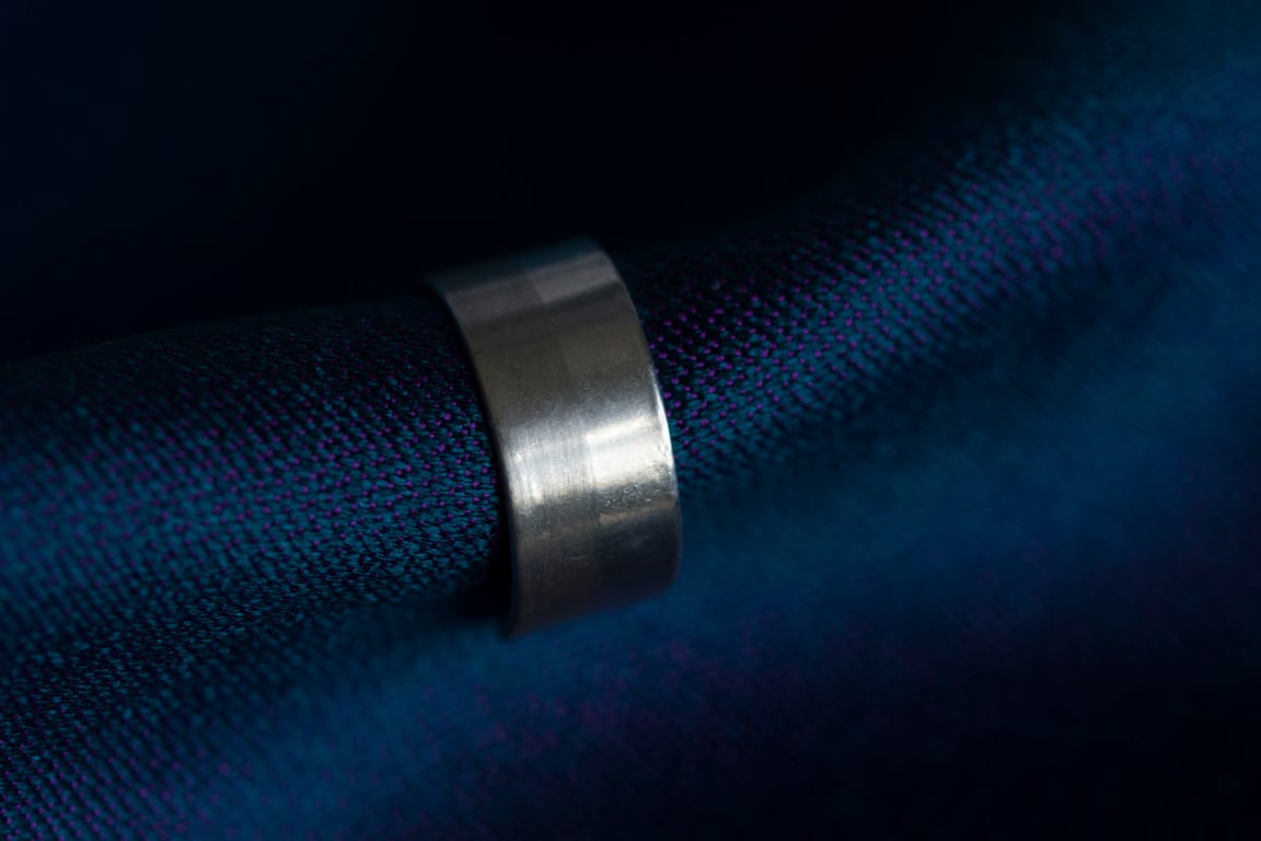 Slim silver ear cuff with a two tone texture, brush matte and mirror polished