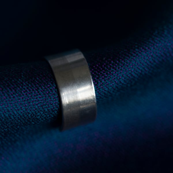 Slim silver ear cuff with a two tone texture, brush matte and mirror polished