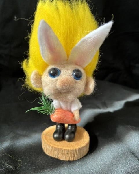 munchkin bunny in white dungerees