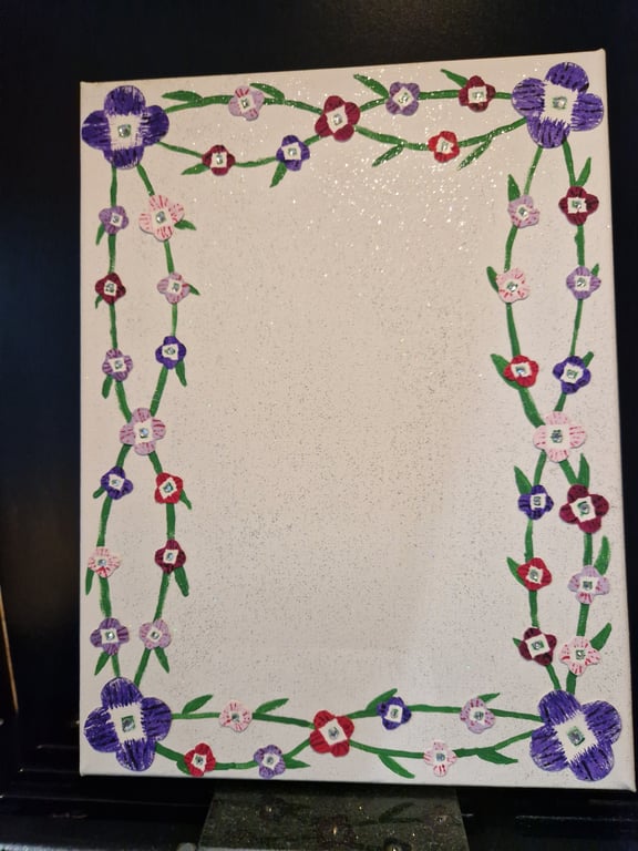 Pastel flowers on canvas photo frame. 
