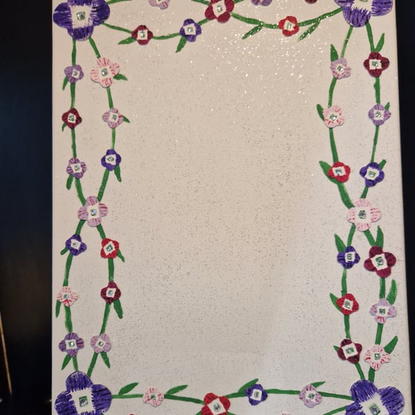 Pastel flowers on canvas photo frame. 