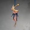 Wooden hanging decoration of a moon man named Carter. Double sided