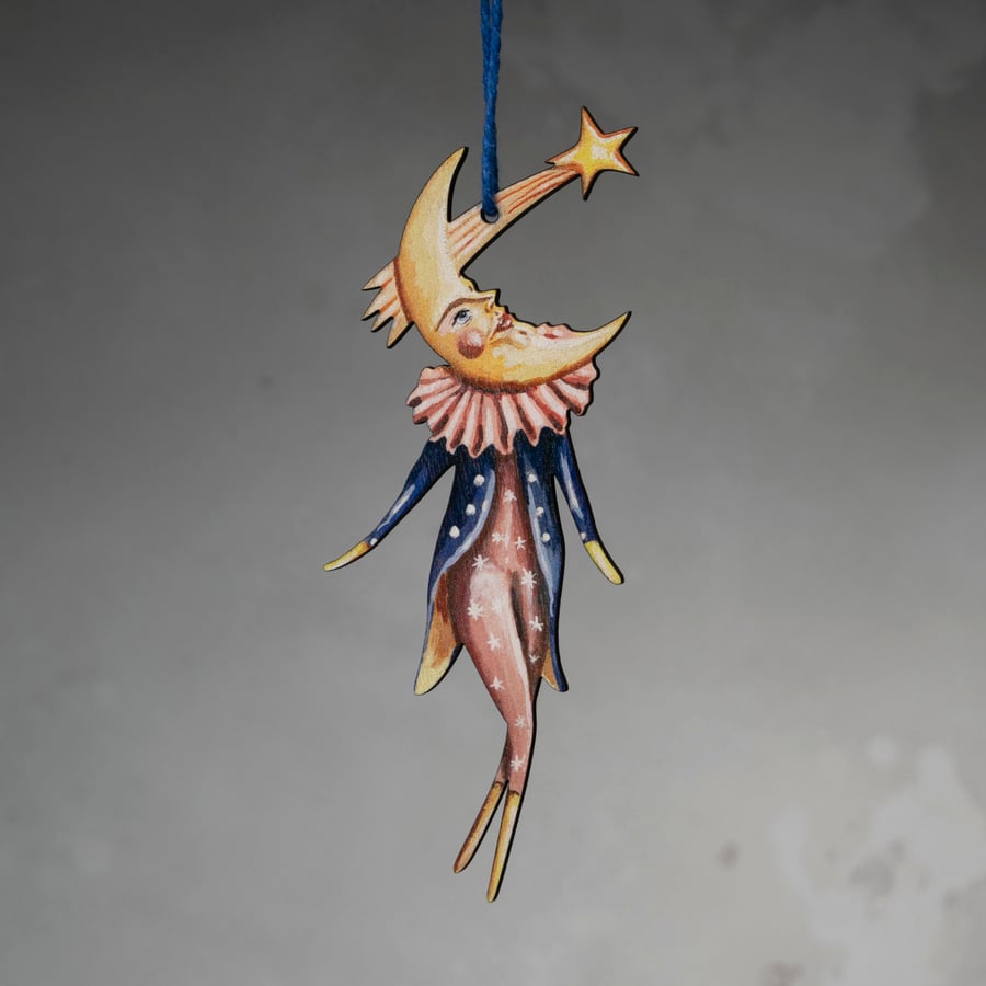 Wooden hanging decoration of a moon man named Carter. Double sided