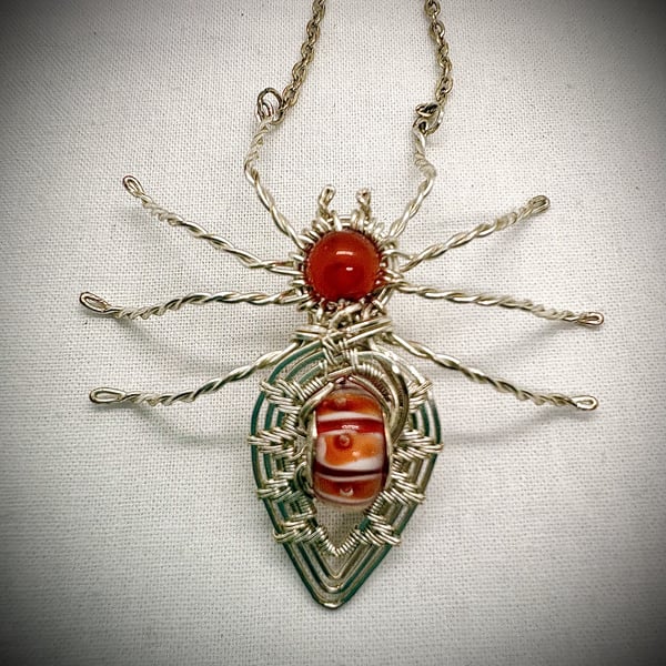 Silver wire wrapped Spider with Orange Agate
