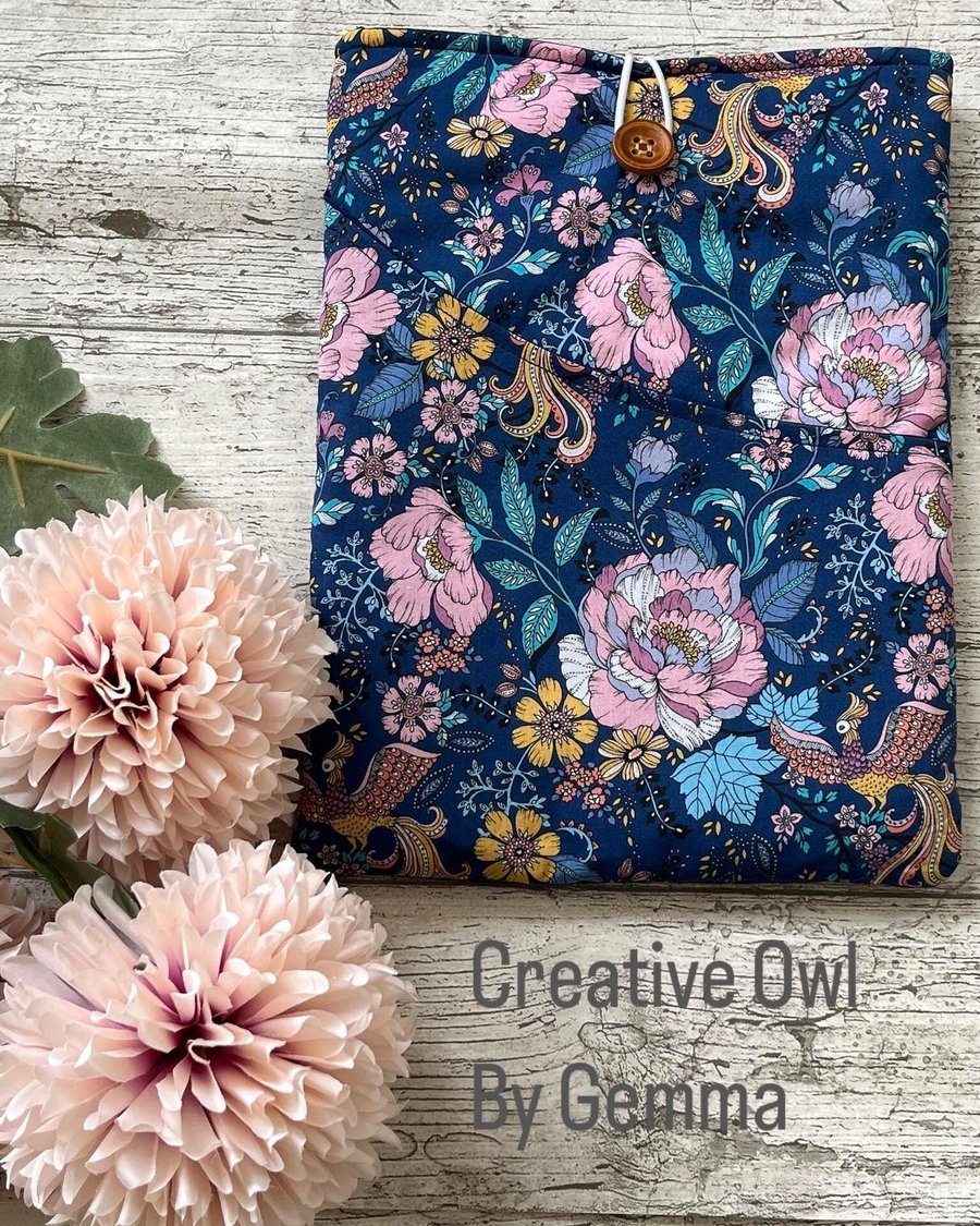 Fabric book sleeve with pocket for paperback books. Padded and fully lined. Hand