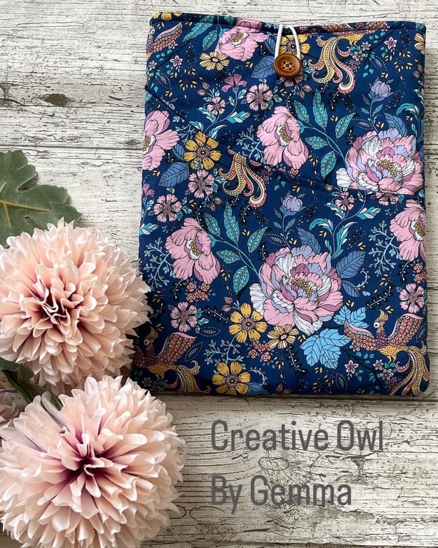 Fabric book sleeve with pocket for paperback books. Padded and fully lined. Hand