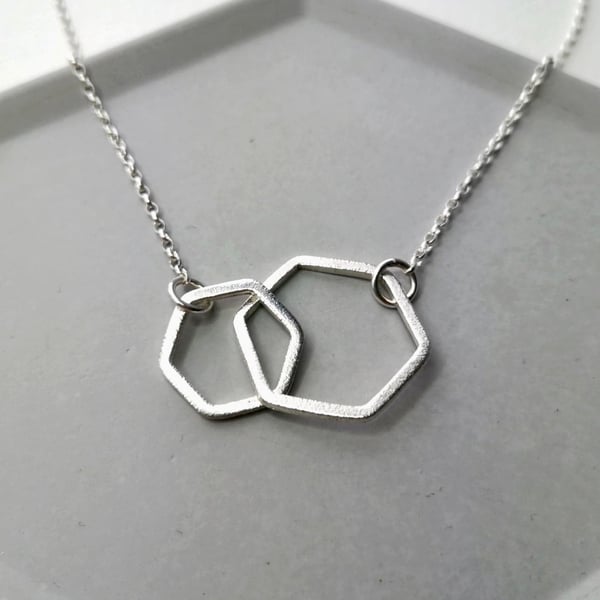 Interlinked hexagon necklace