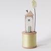 Wooden House on a Vintage Bobbin with Clay Tree