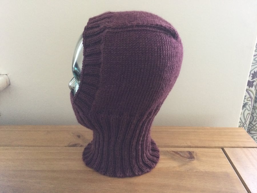 A woman’s lovely hand knitted merino wool balaclava in burgundy, new.