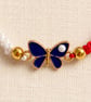 Red and White Macramé Bracelet with Blue Butterfly – Adjustable - Image 4