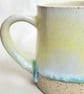 A handmade stoneware mug in yellow, green and oatmeal - Image 4