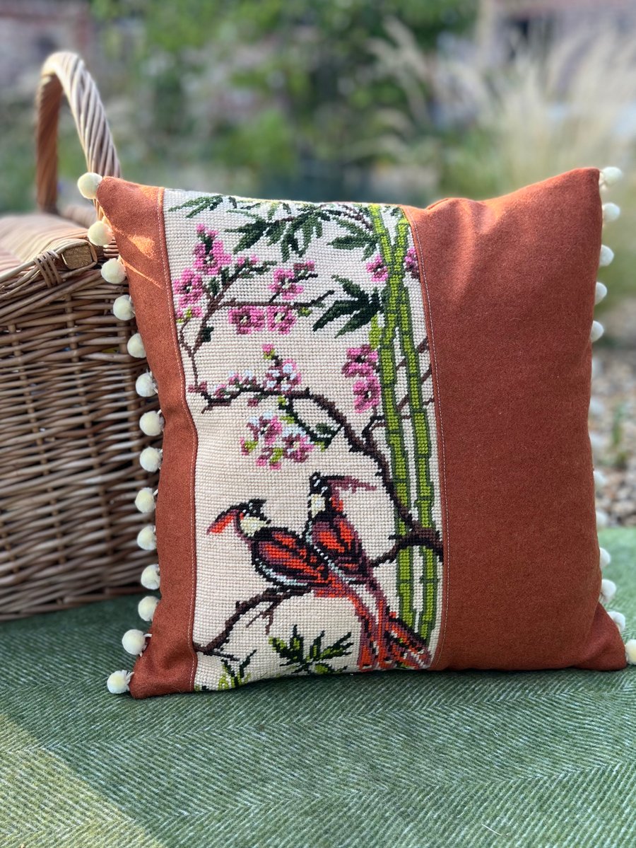 Exotic birds tapestry cushion cover with orange wool and pompoms