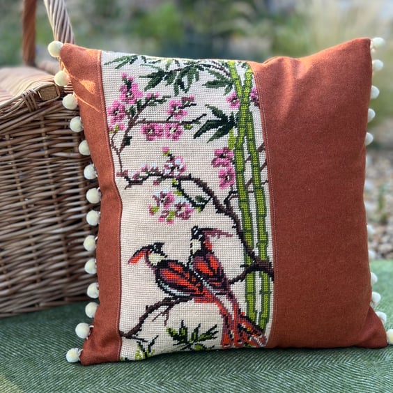 Exotic birds tapestry cushion cover with orange wool and pompoms