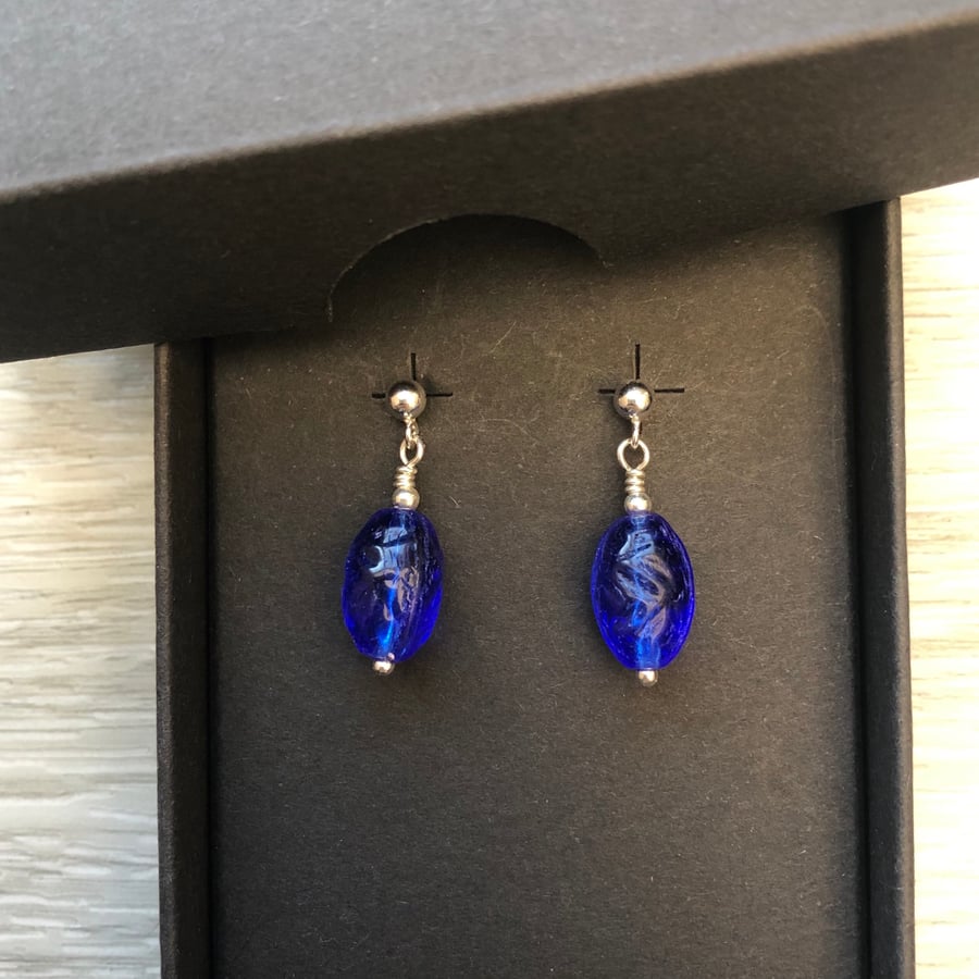 Blue oval glass drop post earrings. Sterling silver 