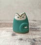 Small turquoise green pottery cat case