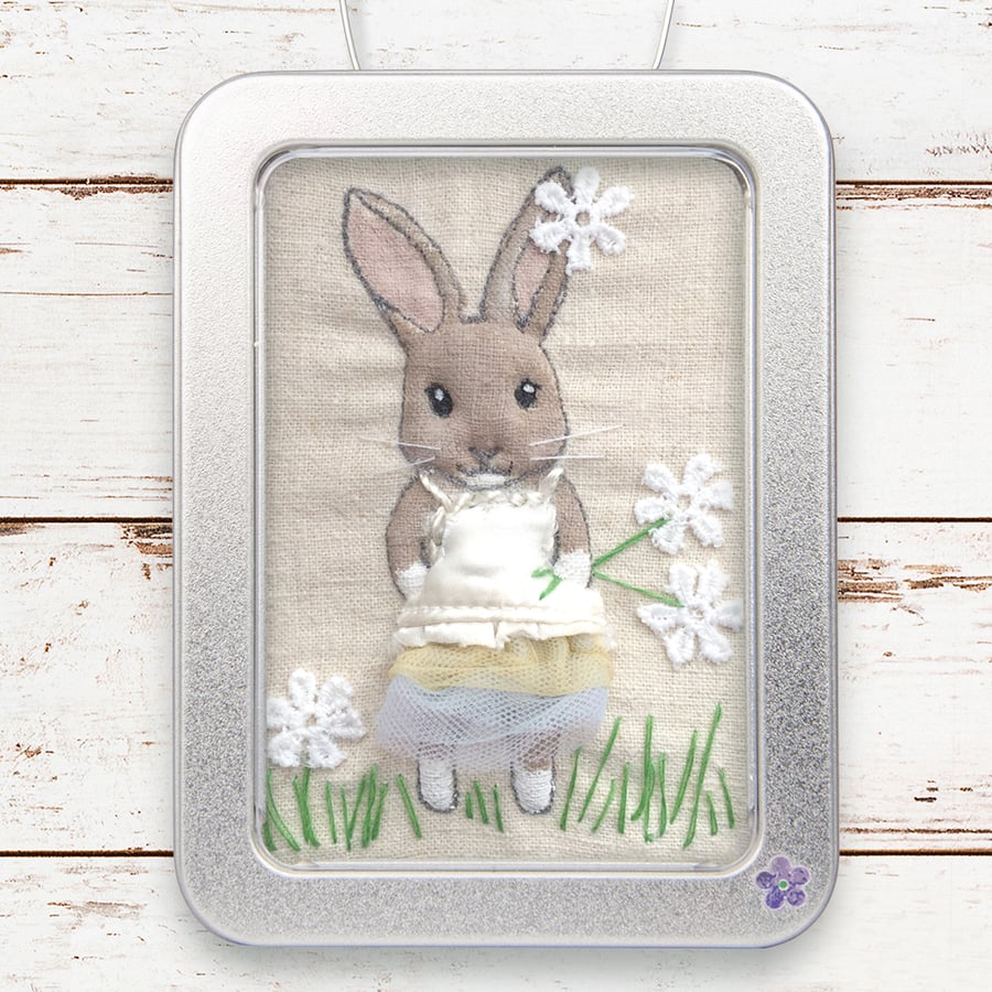 Rabbit, dressed-up rabbit picture, framed in a tin