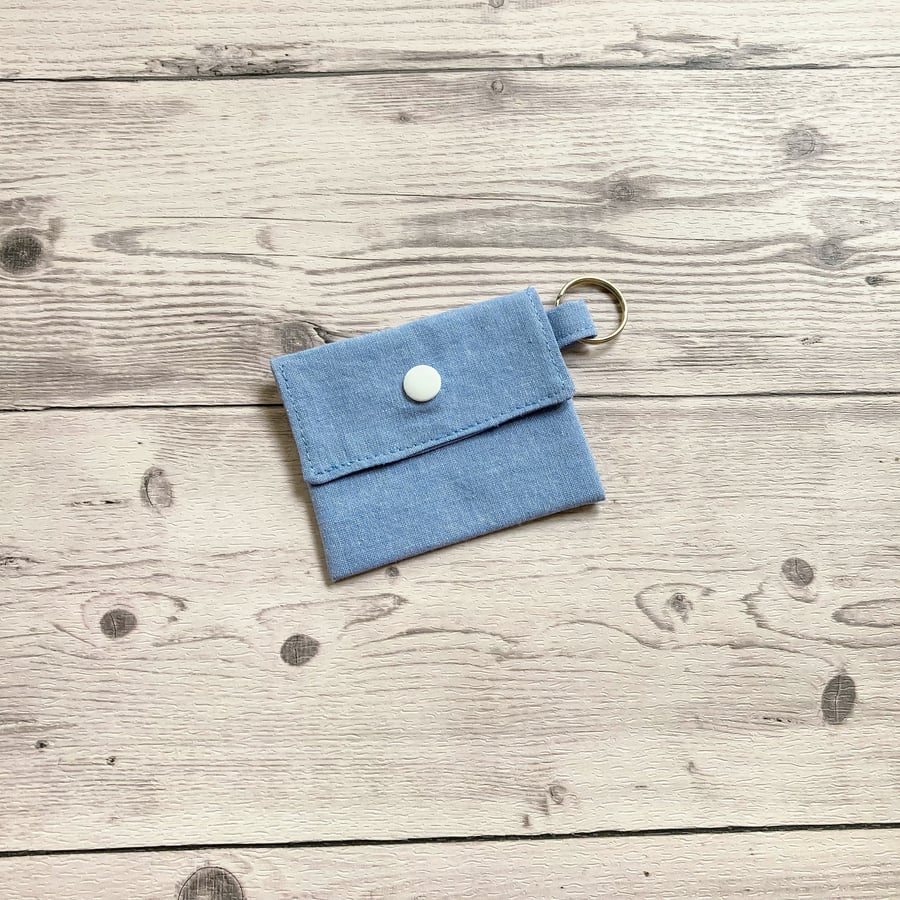 Plain light blue colour round lip balm keyring, keychain. Lipstick holder.