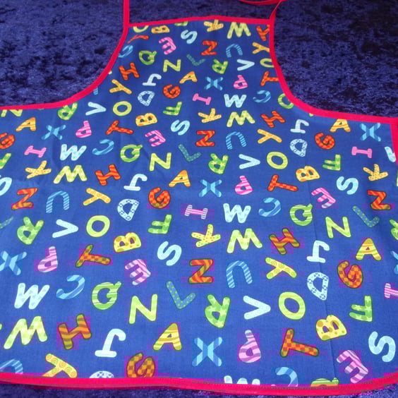 Colourful Alphabet Baby Apron with Red Bias Binding