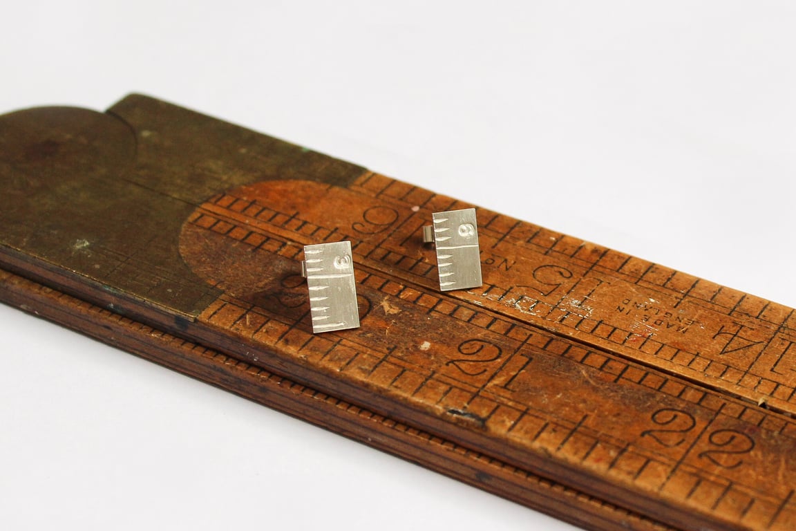 Measured earrings, tape measure ear studs, seamstress
