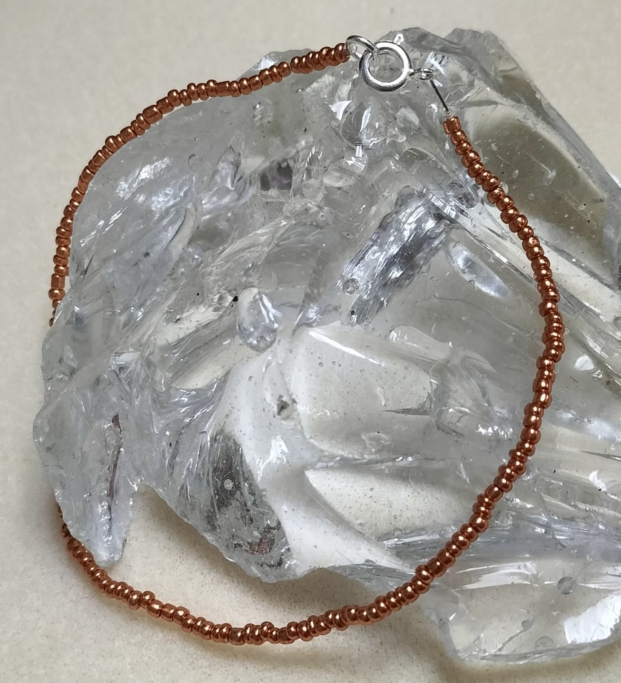 AL126 Orange seed bead anklet