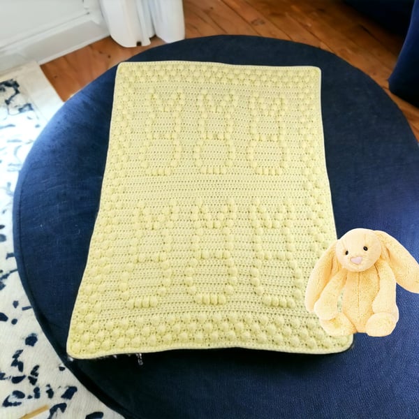 Crochet baby blanket in lemon with puff bobbly bunny pattern
