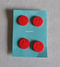 Red smiley face buttons - Image 1