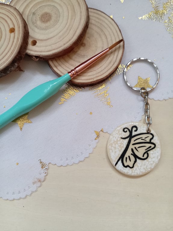 Wooden circular butterfly keyring 