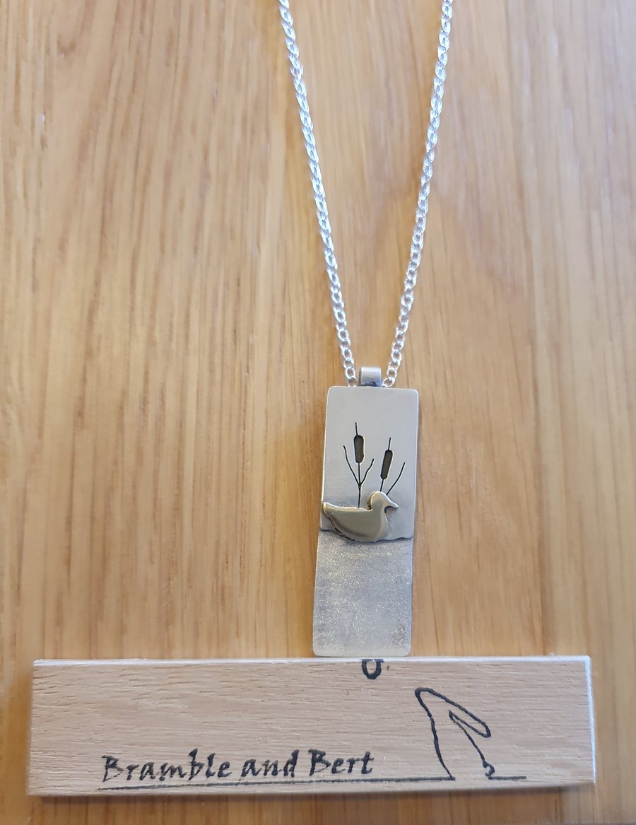 Sterling silver necklace - brass duck swimming on a pond