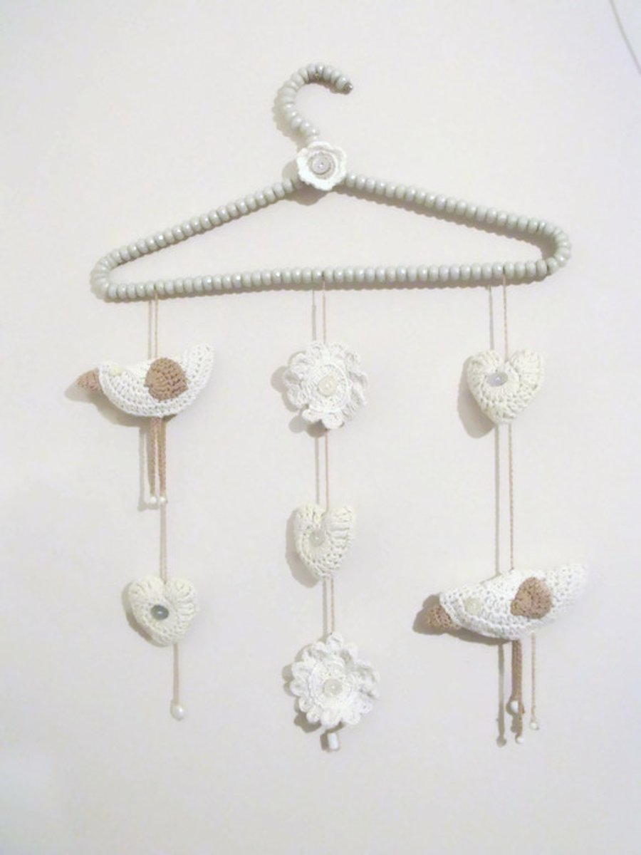 crochet bird, flowers and hearts hanging wall decorations in neutral shades