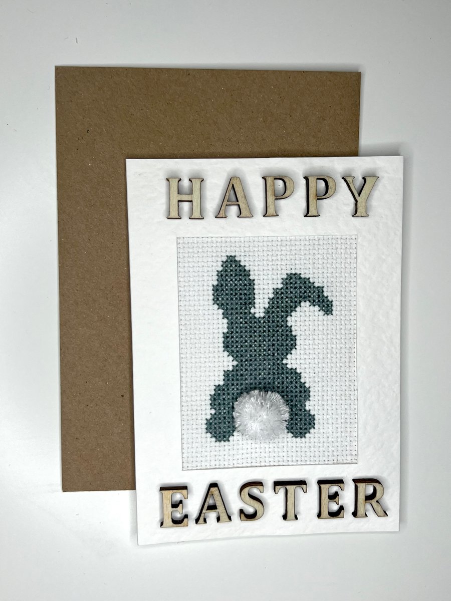 Happy Easter blue bunny with pompon