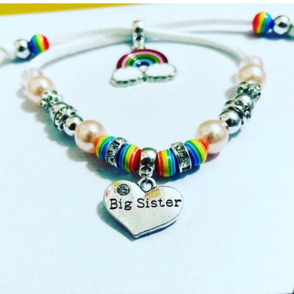 White suede effect corded big sister rainbow charm bracelet 
