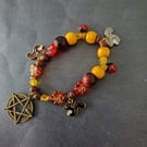 Elasticated nature-inspired beaded charm bracelet with pentacle