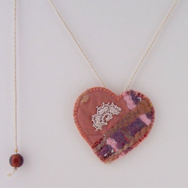 Hand and machine embroidered love heart textile necklace