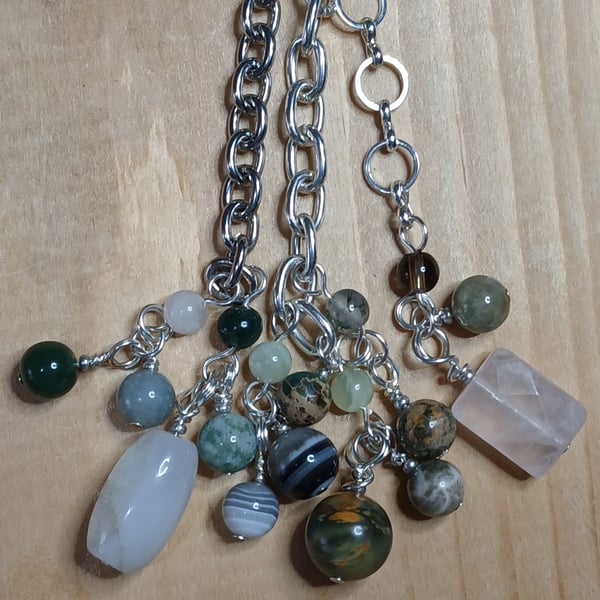 Bag charm with various natural stone, honed to a smooth finish.