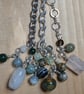 Bag charm with various natural stone, honed to a smooth finish.