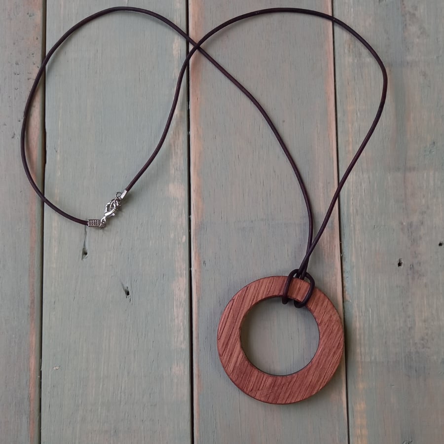 Handmade wooden pendant is crafted from reclaimed teak