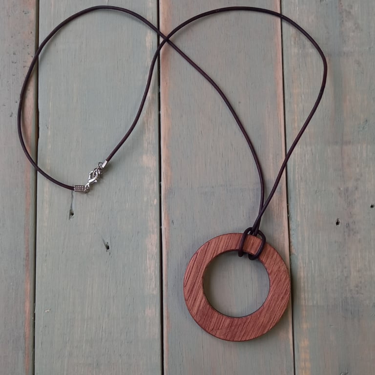 Handmade wooden pendant is crafted from reclaimed teak