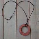 Handmade wooden pendant is crafted from reclaimed teak