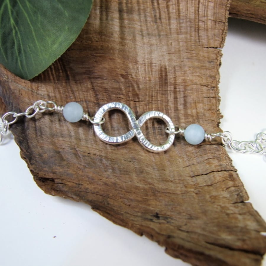 Infinity Knot Bracelet. Sterling Silver and Aquamarine