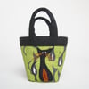 Tiny green bag with cat print and cat appliqué